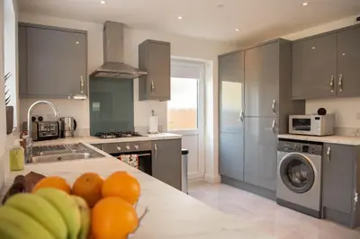a kitchen with a counter top with fruit on it at RiverTree House in Llangollen