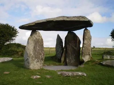 a group of large rocks with a mushroom on top at Arwel in New Quay