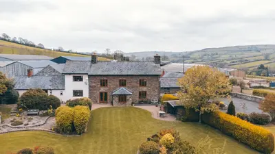 an aerial view of a house with a yard at Llanhedric House in Clun
