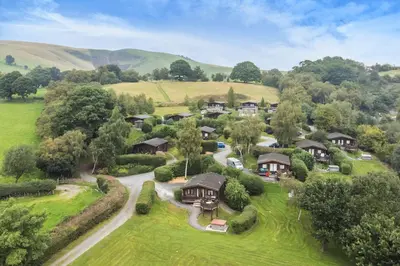 an aerial view of a home in the hills at Tawny Owl Lodge in Rhayader