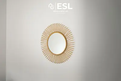 a mirror with a gold rim on a white background at 2 Bedroom Terrace Cottage, Parking, 5 minutes drive to Royal Shrewsbury Hospital in Shrewsbury