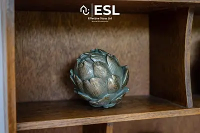 a brass relief of a artichoke on a wooden shelf at Quarry View Garden Studio in Shrewsbury with Parking in Shrewsbury