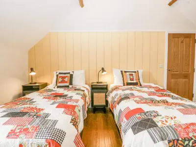 two beds sitting next to each other in a room at Belle Vue in Hereford