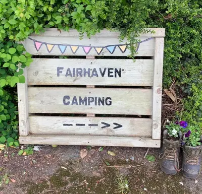 a sign for a garden with the name of a garden at Willowdene shepherds hut in Oswestry