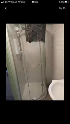 a shower in a bathroom with a toilet and a sink at Shepherds hut Lowri in Dolgellau