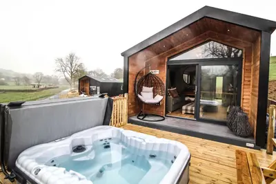 a large bath tub sitting on top of a house at Fawns Rest in Nantmel
