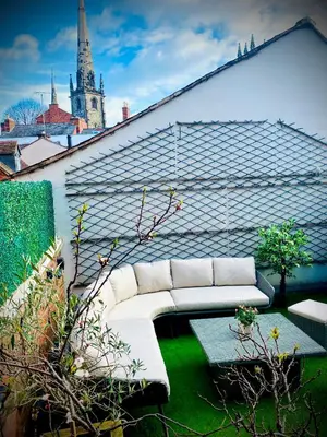 a white couch sitting on top of a roof at Superbly Located Handsome Georgian Townhouse - Pass the Keys in Shrewsbury