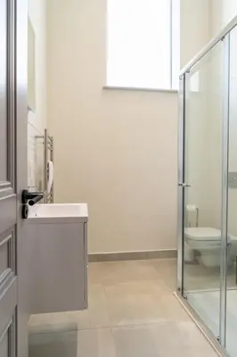 a bathroom with a sink and a toilet at The Old Glassworks by Bevolve in Shrewsbury