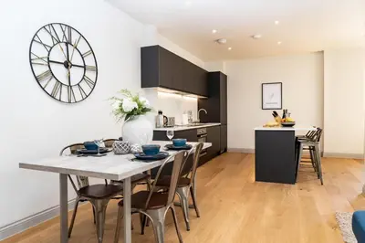 a kitchen and dining room with a table and chairs at The Old Glassworks by Bevolve in Shrewsbury