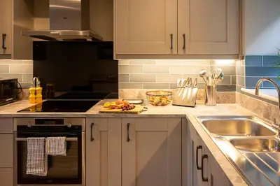 a kitchen with a sink and a counter top at The Fanny Talbot in Barmouth