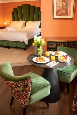 a hotel room with a table with food on it at The Fanny Talbot in Barmouth