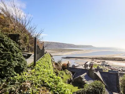 a view of the beach from the hillside at Ty'n-Y-Ffynnon Cottage in Barmouth