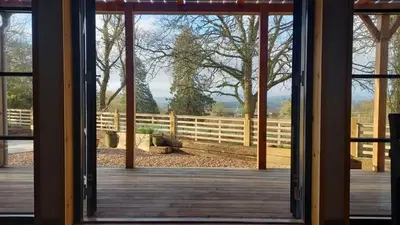 an open door to a deck with a fence at 1 Bed in Builth Wells oc-p27441 in Builth Road
