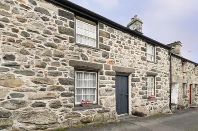 an old stone building with two windows and a door at 2 Bed in Dolgellau oc-wah671 in Dolgellau