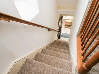 a staircase in a house with a stair case at 1 Hetfield Cottages in Bishops Castle