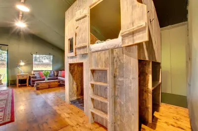 a room with a bunk bed and a living room at 3 Bed in Talybont On Usk oc-wal375 in Talybont