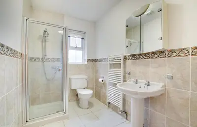 a bathroom with a toilet and a sink and a shower at 5 Bed in Aberystwyth oc-wan443 in Llanychaiarn