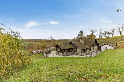 a large house on top of a grassy hill at 4 Bed in Builth Wells oc-bow197 in Builth Wells