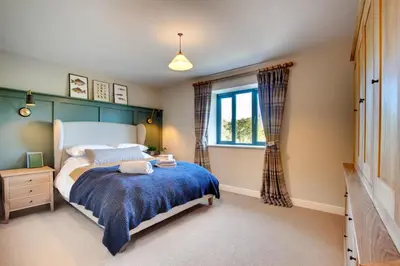 a bedroom with a bed and a window at 2 Bed in Builth Wells oc-bow198 in Builth Wells