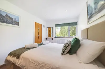 a bedroom with a large white bed with pillows at 4 Bed in Ffestiniog oc-bow172 in Ffestiniog